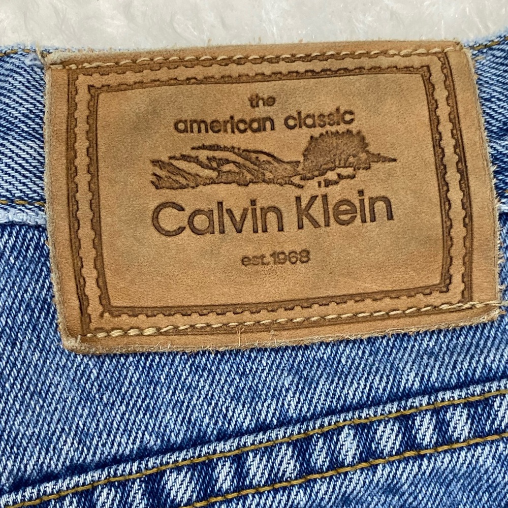 Calvin Klein blue jeans size 10, front zip button fly